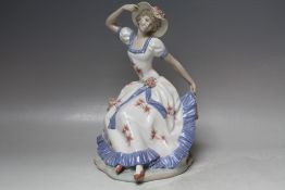 A LARGE NAO SEATED FEMALE FIGURINE, H 29 cm