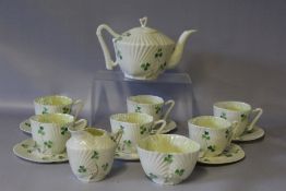 A BELLEEK SECOND PERIOD CLOVER SHAPED TEA SET, comprising teapot, cream jug, sugar bowl with six