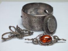 A HALLMARKED SILVER WIDE CUFF BANGLE WITH ENGRAVED DECORATION, together with a hallmarked silver