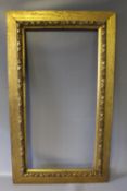 A 19TH CENTURY GOLD FRAME WITH DECORATIVE INSIDE EDGE, frame W 8 cm, rebate approx 38 x 76 cm