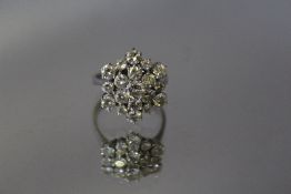 AN 18CT GOLD DIAMOND CLUSTER RING, estimated 1.6 carats in total