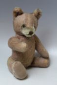 A VINTAGE PLAYWORN MOHAIR STEIFF TEDDY BEAR, H 35 cm