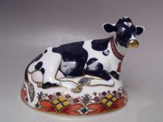 A ROYAL CROWN DERBY FRIESIAN COW 'BUTTERCUP' PAPERWEIGHT, gold stopper, with box, w 16.3 cm, H 12