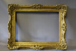 A 19TH CENTURY GOLD SWEPT FRAME, frame W 8 cm, rebate 50 x 35 cm