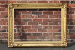 A 19TH CENTURY DECORATIVE GOLD FRAME WITH CORNER EMBELLISHMENTS AND GOLD SLIP, frame W 10 cm, slip