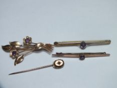 TWO 9CT GOLD BAR BROOCHES SET WITH SINGLE AMETHYST. largest W 5.5 cm, combined weight approx. 4.8 g,
