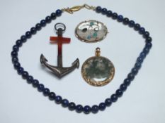 A SINGLE STRAND LAPIS LAZULI POLISHED BEAD NECKLACE, together with a moss agate circular pendant, an