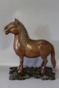 A JAPANESE STYLE HARDWOOD CARVING OF A HORSE ON STAND, a/f, W 19 cmCondition Report:tail restored