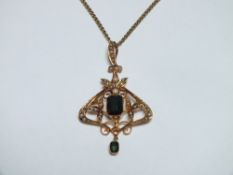 A 15CT GOLD PENDANT ON CHAIN, set with emerald cut green stones and seed pearls, approx weight 8.4g