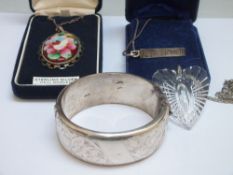 A HALLMARKED SILVER HINGED BANGLE. together with a hallmarked 'Toblerone' pendant, a Stratton silver