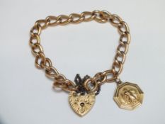A HALLMARKED 15 CT GOLD BRACELET, with 9 carat gold padlock, together with a small St Christopher,