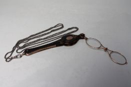 A PAIR OF VICTORIAN YELLOW METAL AND TORTOISESHELL SPRUNG FOLDING LORGNETTES, with attached white