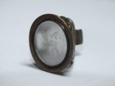 A ROCK CRYSTAL TYPE INTAGLIO SET AS A FOB, W 2.5 cm