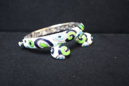 A ROBERTO COIN 18CT WHITE GOLD AND DIAMOND ENAMELLED BANGLE AND PAIR OF EAR-CLIPS FROM THE 'VINTAGE'