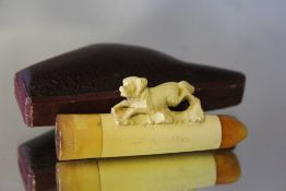 A CARVED MEERSCHAUM CHEROOT HOLDER, with a running dog and in fitted case, W 7 cm