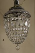A GLASS CRYSTAL LUSTRE CEILING LIGHT WITH MOUNTING ROSE. having various cut glass droppers forming a