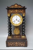 A LATE 19TH CENTURY FRENCH ROSEWOOD AND INLAID PORTICO CLOCK, the circular cased movement with