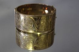 A HALLMARKED 9 CT GOLD WIDE BANGLE, approx weight 47.5g, W 2.75 cm
