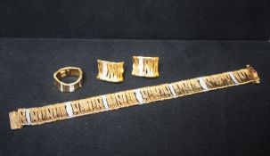 A ROBERTO COIN 18CT YELLOW GOLD AND DIAMOND BRACELET WITH MATCHING RING AND EAR CLIPS FROM THE