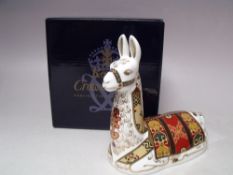 A ROYAL CROWN DERBY COLLECTORS GUILD LLAMA PAPERWEIGHT, gold stopper, with box, H 13 cm, L 14 cm