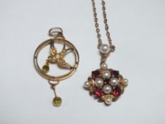 AN EDWARDIAN YELLOW METAL SEED PEARL AND GARNET SET PENDANT ON CHAIN, indistinct marks to reverse,