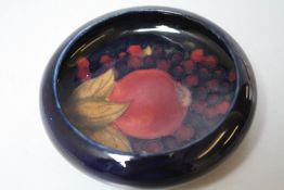 A MOORCROFT POMEGRANATE LOW PIN DISH, impressed marks to the base, Dia. 11 cm
