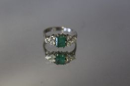 AN 18 CT WHITE GOLD EMERALD AND DIAMOND RING, ring size N
