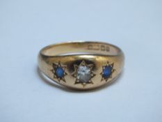 A HALLMARKED THREE STONE RING, carat stamp indistinct, approx weight 8g, ring size YCondition