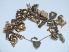 A HALLMARKED 9 CT GOLD CHARM BRACELET, approx weight 79.2g