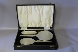 A CASED HALLMARKED SILVER DRESSING TABLE SET - BIRMINGHAM 1963, W 32 cm
