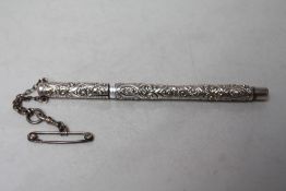 A STERLING SILVER SWAN FOUNTAIN PEN BY MABIE TODD & CO NEW YORK, with attached chatelaine style