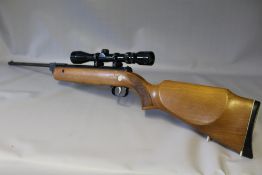 A DIANA SERIES 70 MODEL 79 .22 AIR RIFLE WITH TELESCOPIC SIGHT, wooden stock and having a Diana
