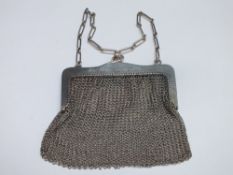 A LADIES SILVER AND MESH LINK PURSE, the frame stamped .925 with makers mark for H & Co., carry