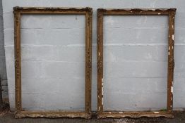 A PAIR OF MID 20TH CENTURY GOLD SWEPT FRAMES, one with damages, frame W 8 cm, rebate approx 139 x 92