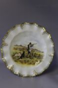 A ROYAL CROWN DERBY CABINET PLATE SIGNED BY J DOYLE, hand painted with a sportsman with his dogs,