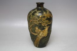 AN UNUSUAL ORIENTAL BRONZED BALUSTER VASE, decorated in gilt relief with mythical birds amongst