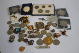 A BOX OF BADGES, MEDALS AND COINS, to include military examples