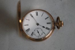 A 9ct GOLD GENTLEMAN'S FULL HUNTER POCKET WATCH (Unsigned) with white enamel dial, with black