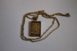 A 9ct GOLD ST CHRISTOPHER INGOT/PENDANT, on a fancy link chain