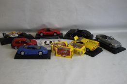 A COLLECTION OF VEHICLES, to include Burago Corgi, Revell etc