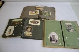 THREE EARLY 20TH CENTURY POSTCARD ALBUMS AND CONTENTS