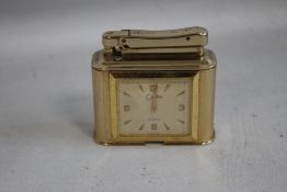 A VINTAGE COLIBRI TABLE LIGHTER, with an eight day clock inset A/F