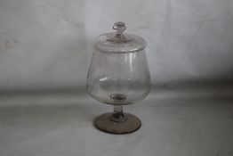 AN 18/19TH CENTURY LIDDED GLASS LEACH JAR (Ground out pontil to base) H 31 cm.