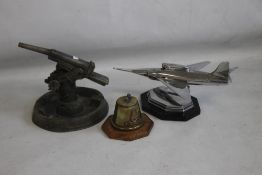 THREE VINTAGE MILITARY INTEREST TABLE LIGHTERS, to include a Trench Art cone with Royal Artillery