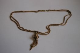 A 9ct GOLD TRIPLE STRAND ROPE NECKLACE, with knot finial.