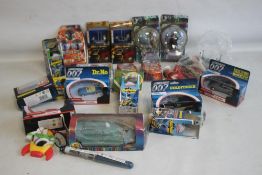 A COLLECTION OF FILM AND TV RELATED MODELS AND TOYS to include four Corgi James Bond 007 Cars -