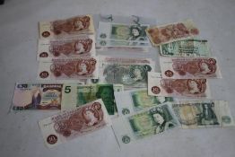 A COLLECTION OF BANK OF ENGLAND 10/- AND £1 NOTES, to include some consecutive pairs and a trio.