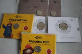 ROYAL MINT MODERN COINS, packs 2 x D-Day, 2 x Paddington Bear 50p and 2 x Prince George £5 coins (