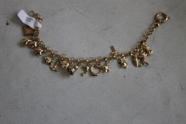 ROYAL MINT 9ct GOLD CHARM BRACELET, with special Royal Mint Tower charm in case of issue with COA.