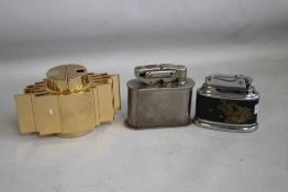 THREE VINTAGE TABLE LIGHTERS, to include a retro type, a Japanese type, and a chrome type